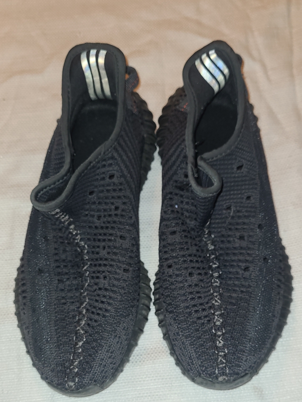 Yeezy Black Knit Slip-On Sneakers with Silver Heel Accents